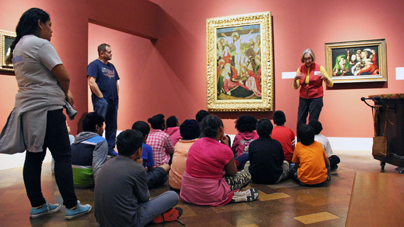docent leading museum tour of students