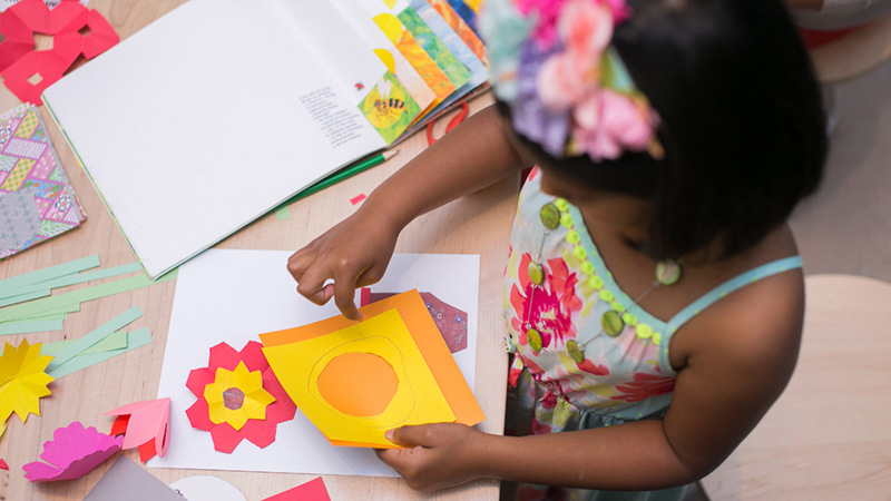 young girl doing crafts