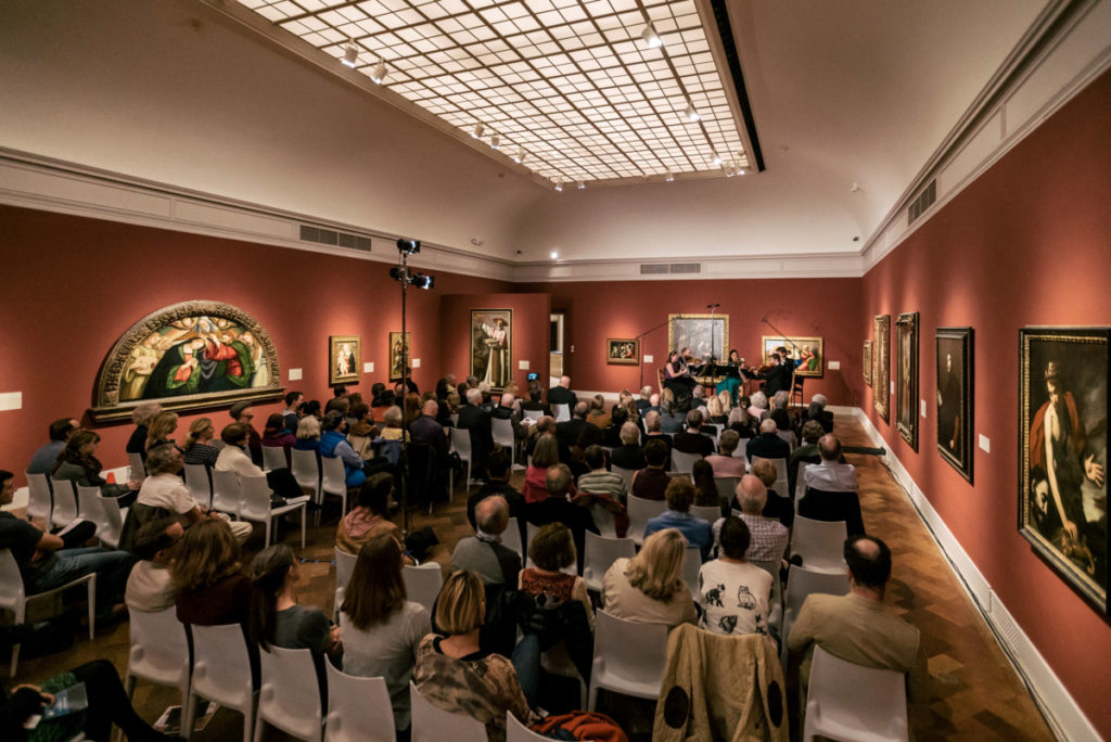 Art of Elan concert performance inside The San Diego Museum of Art with audience