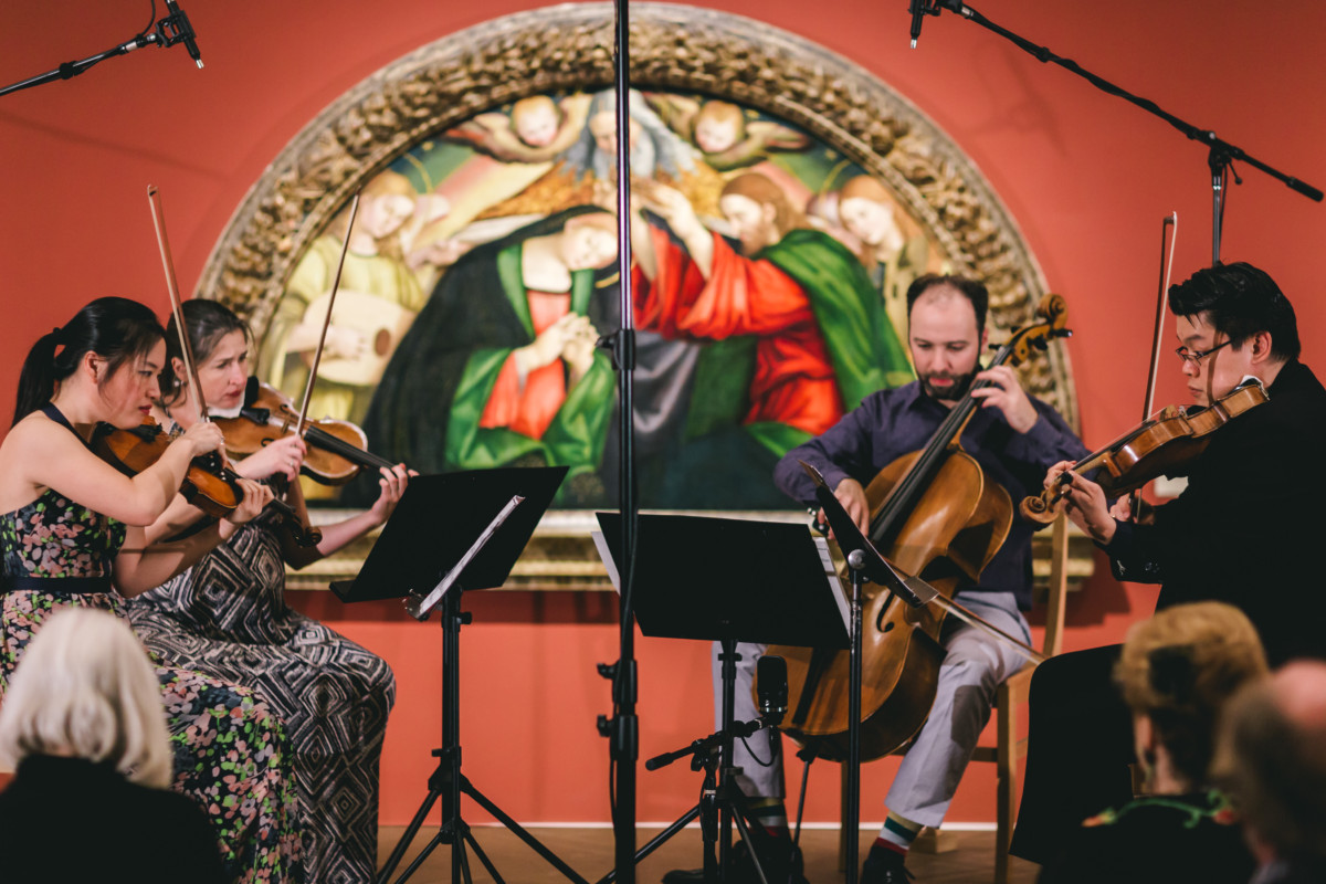 Art of Elan string quartet playing inside museum gallery