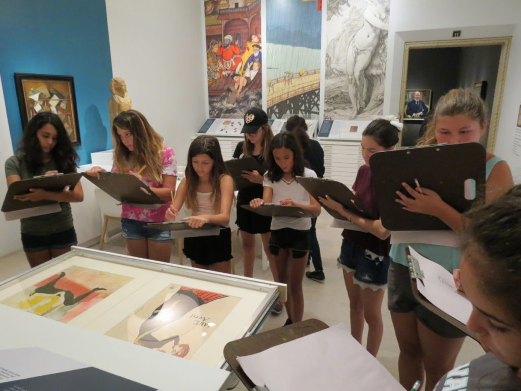 Teens sketching inside The San Diego Museum of Art
