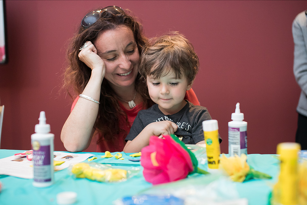 Woman with child at craft table