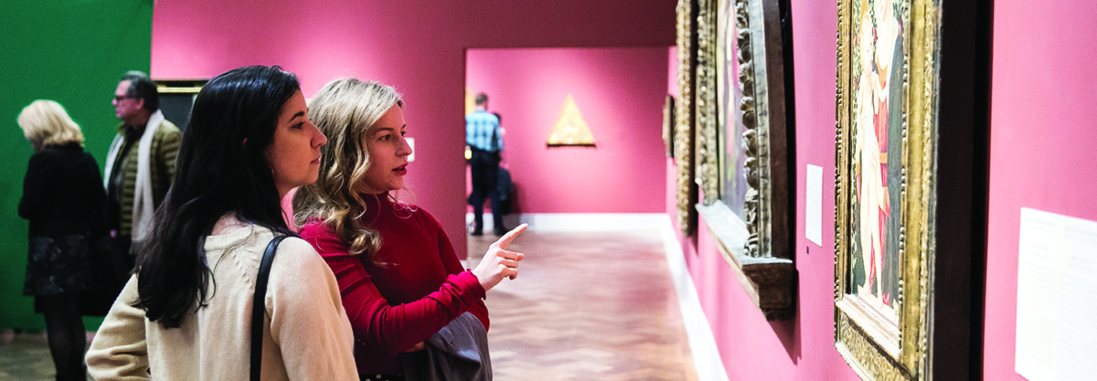 Two women in art museum gallery