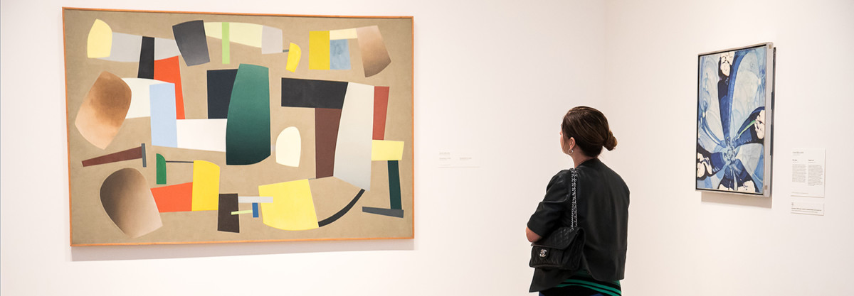 Women looking at modern art in a gallery