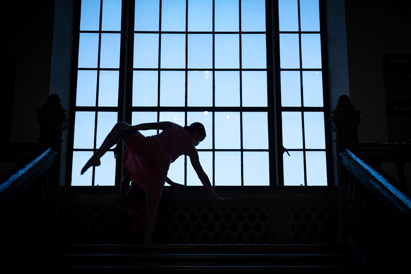 Dancer silhouette in front of large window