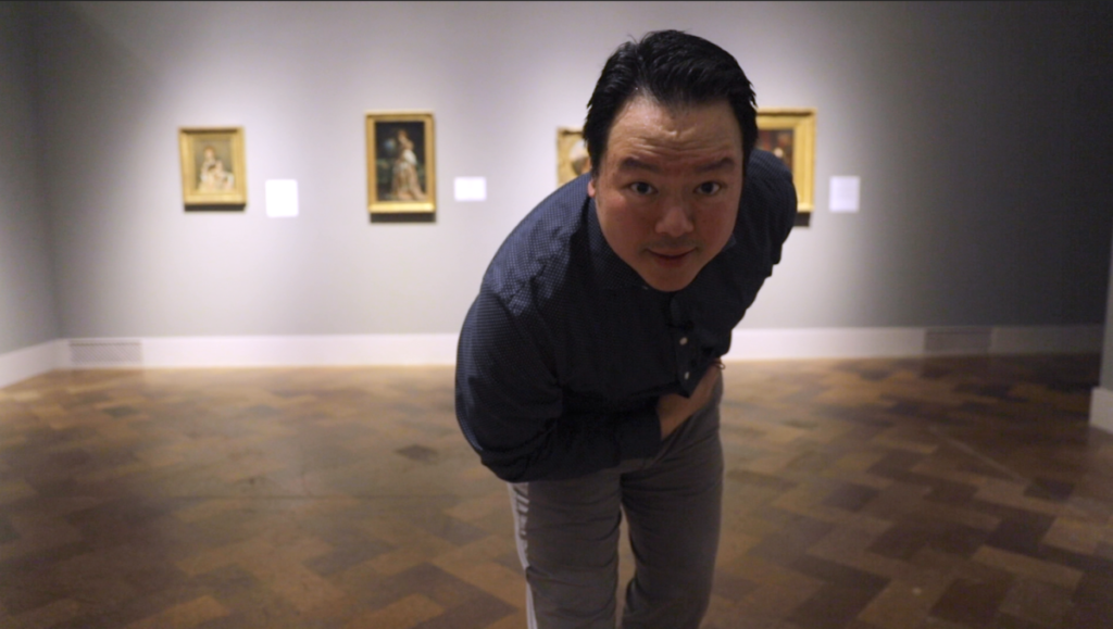 Actor bowing inside art museum