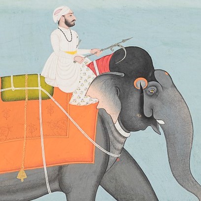 Man riding an elephant