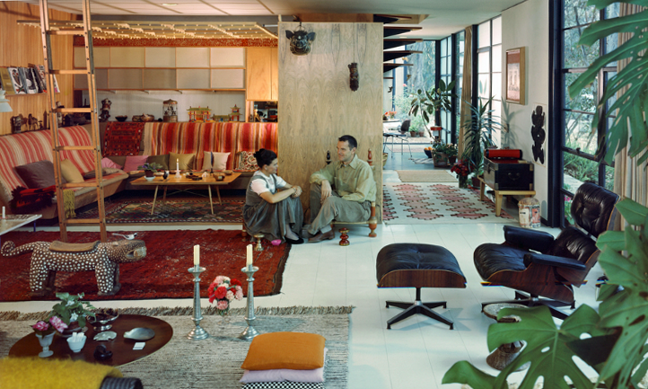 Two people sitting in center of living room