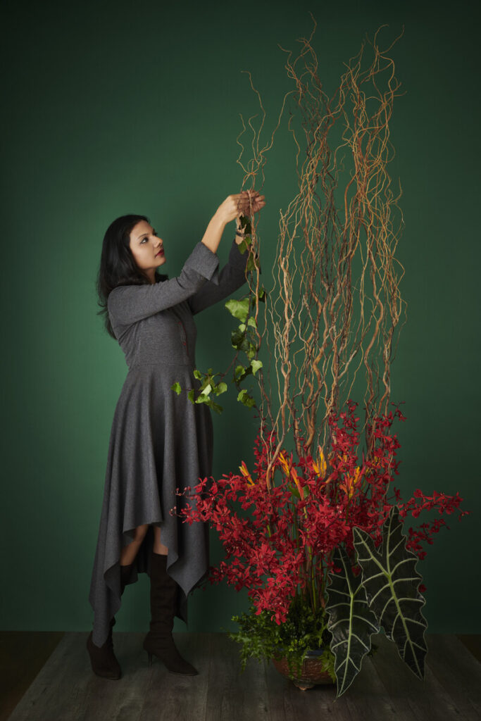 Floral designer Meghaa Modi creating a floral arrangement