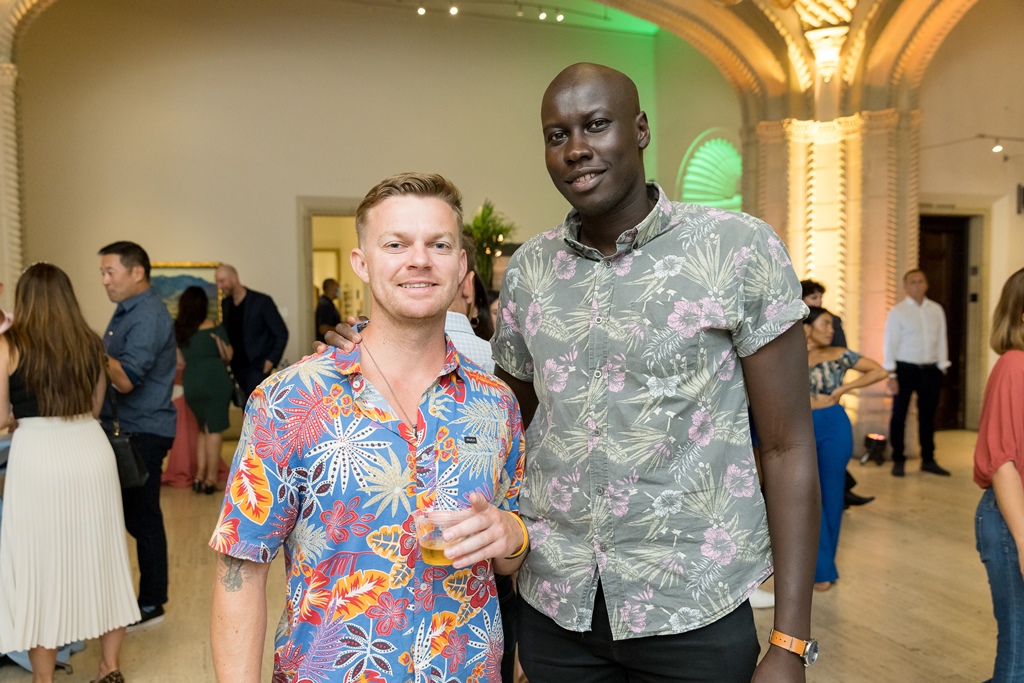 Two men smiling in Museum rotunda