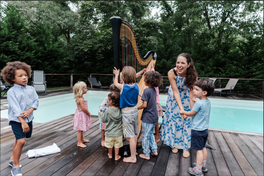 Woman and children with harp