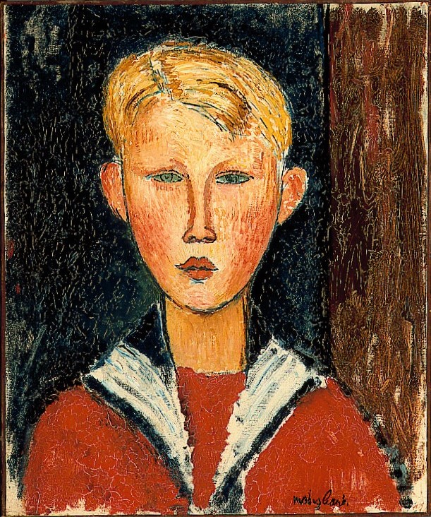 Blond boy with blue eyes wearing a red shirt