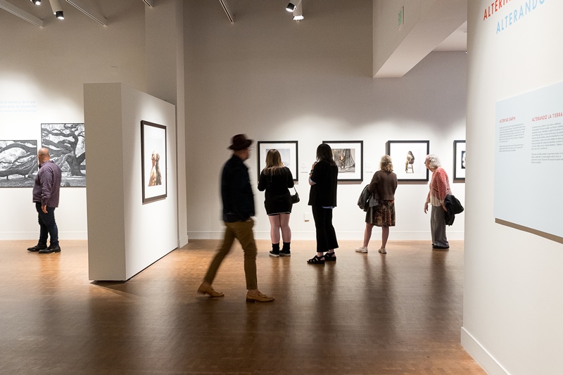 People in the Museum of Photographic Arts at The San Diego Museum of Art galleries