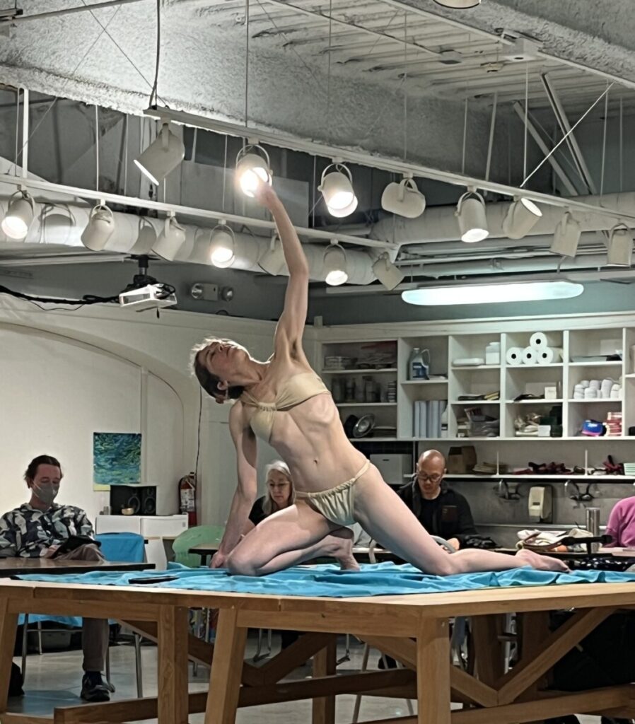 Live model posing during drawing session