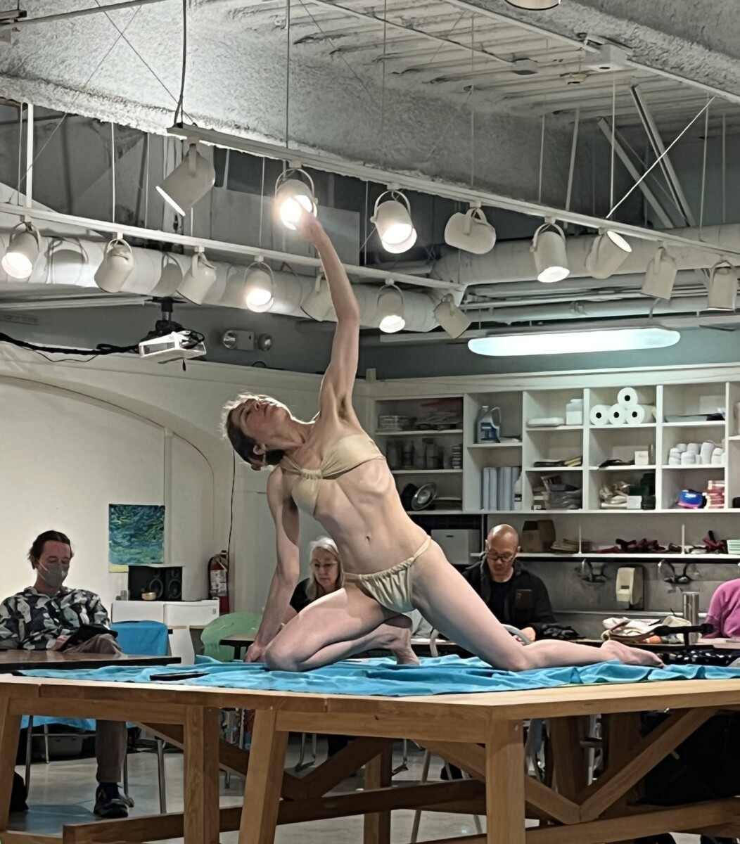 Live model posing during drawing session