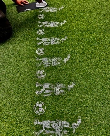 Soccer grass with painted Mesoamerican motif