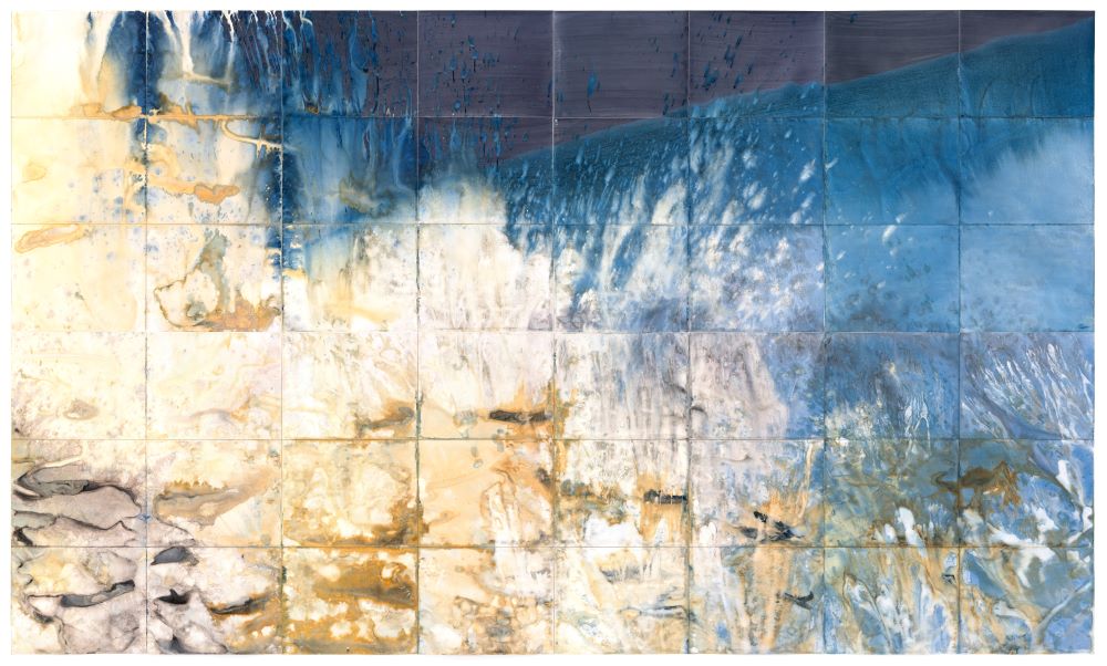 Blue and tan cyanotype of crashing waves at US-Mexico border by Meghann Riepenhoff